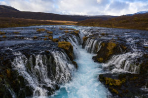 Iceland, waterfall in autumn, barren landscape Iceland, waterfall in autumn, barren landscape